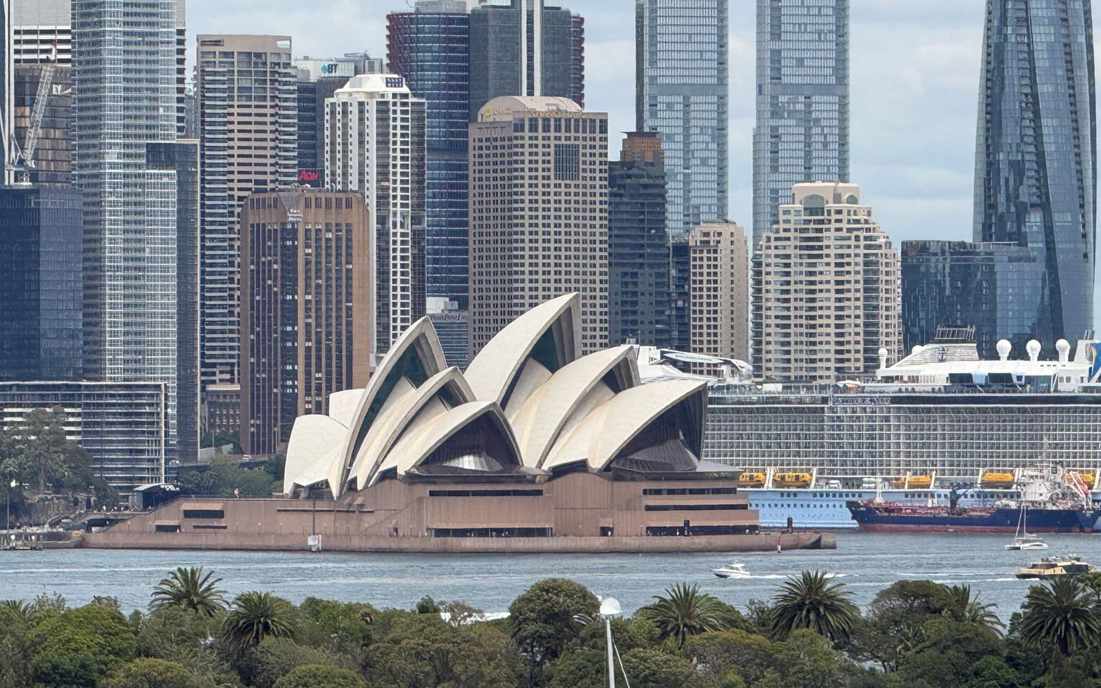 Sydney Opera House with the downtown skyline behind it