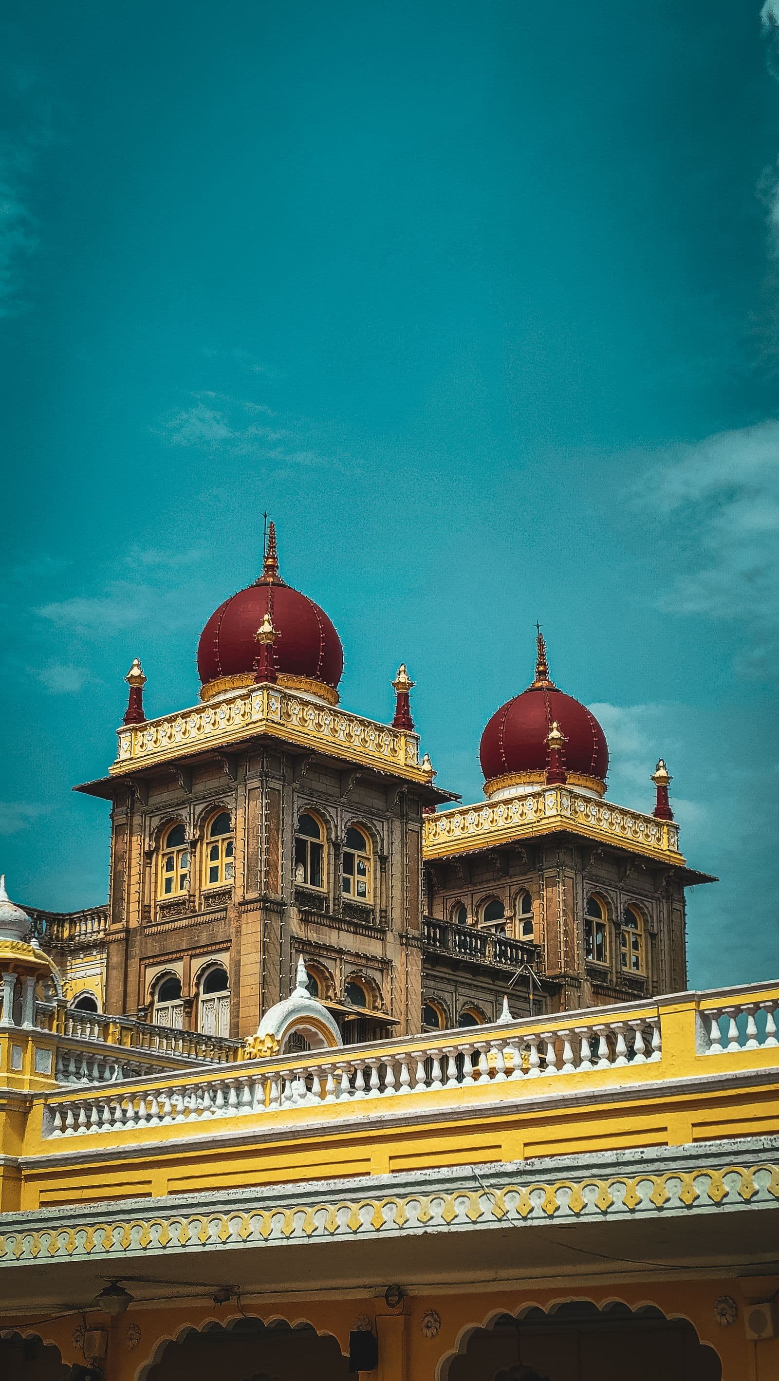The red domes and carved facade of Amba Vilas Palace in Mysore, Karnataka