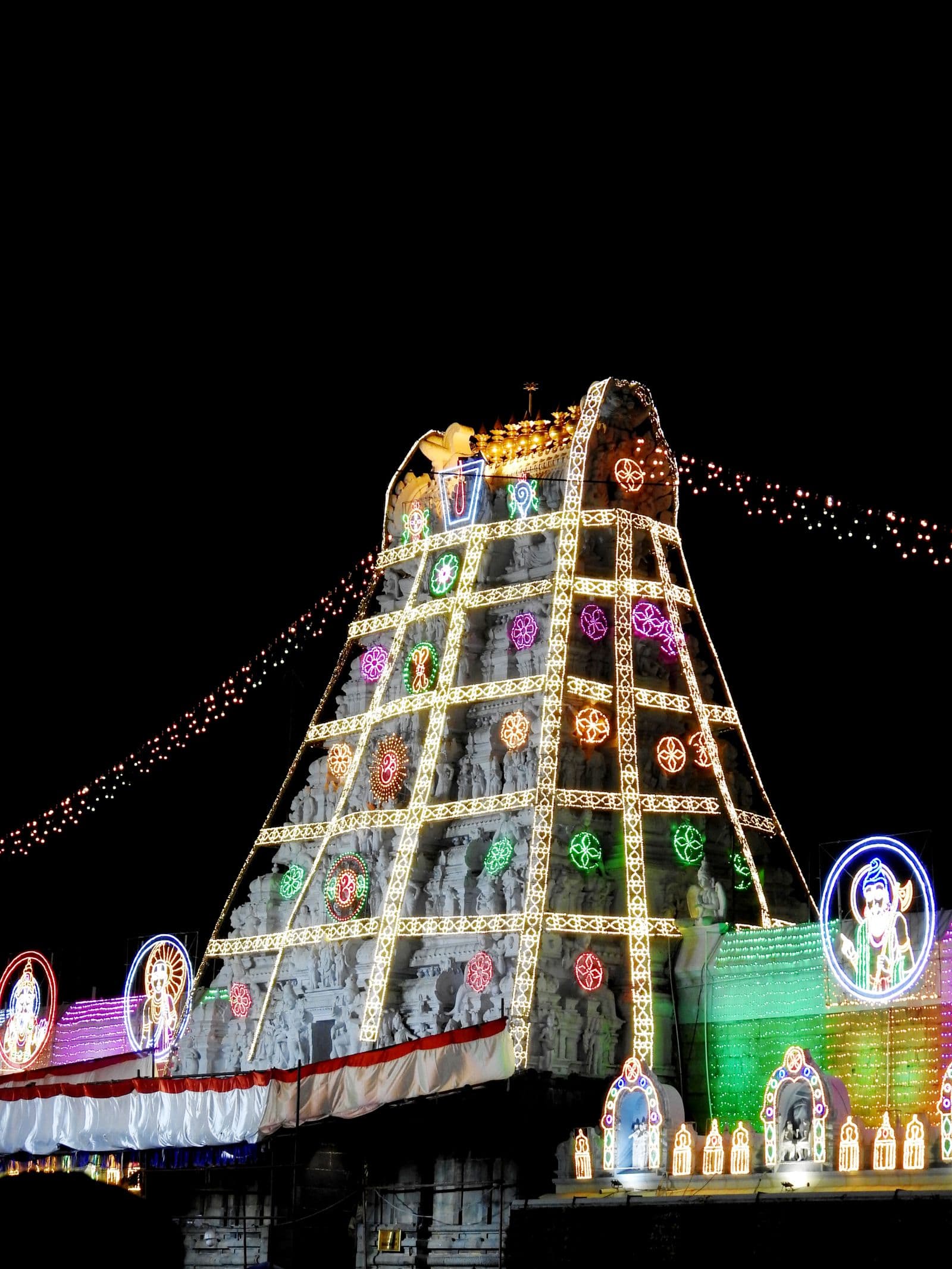 The Tirumala temple lit up during a festival at night