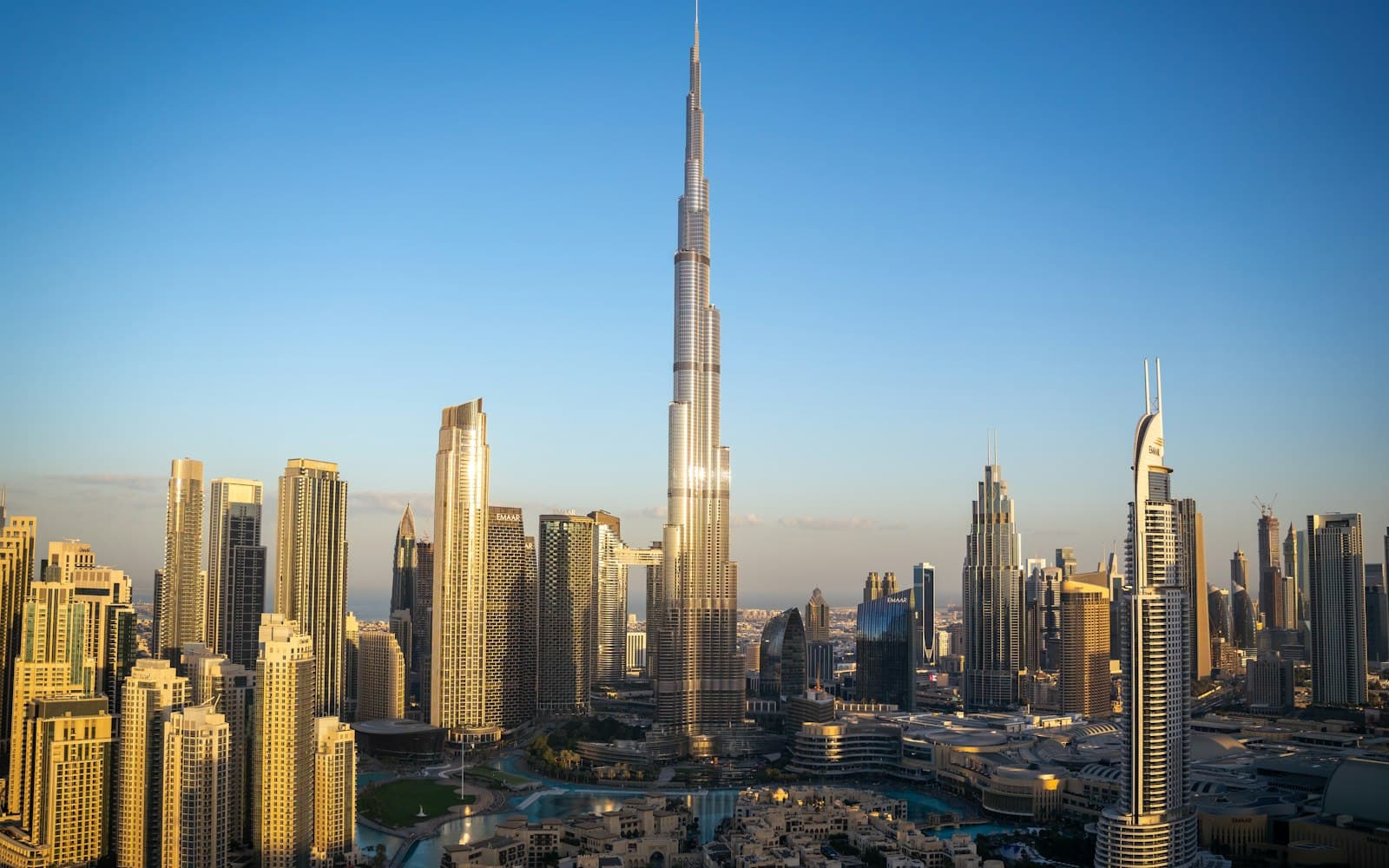 Burj Khalifa rising above the Downtown Dubai towers on a clear morning