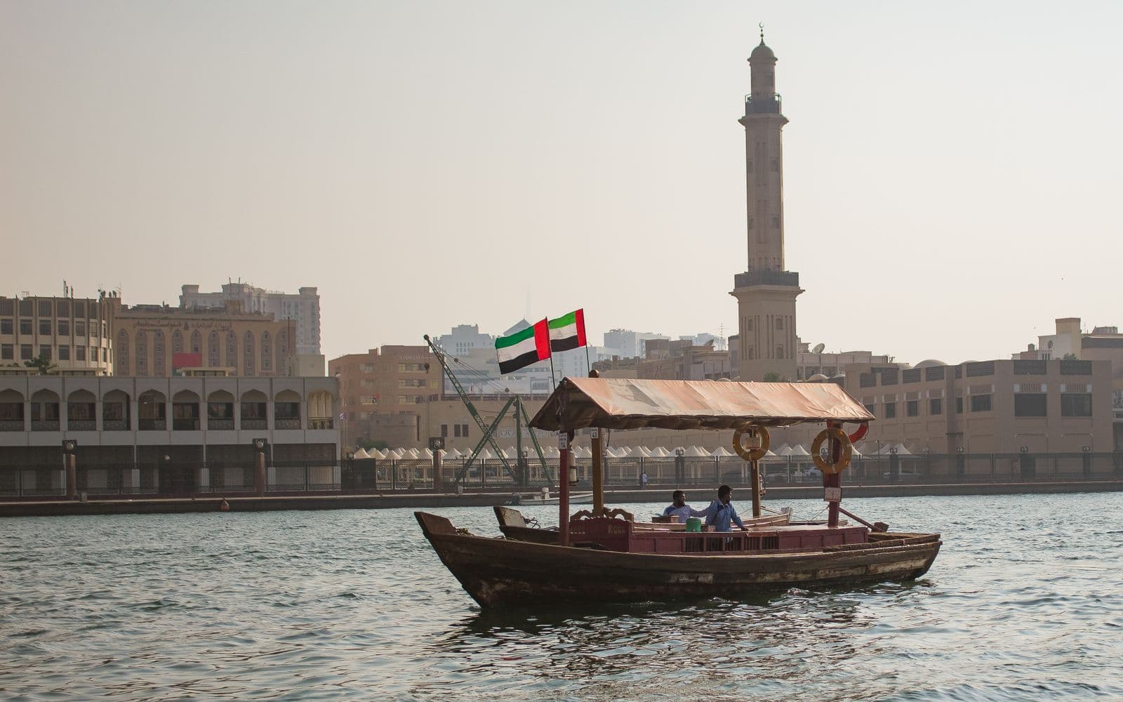A wooden abra boat crossing Dubai Creek in the old town