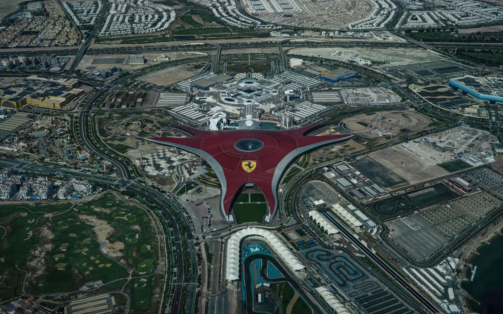 Aerial view of the red Ferrari World roof on Yas Island, Abu Dhabi