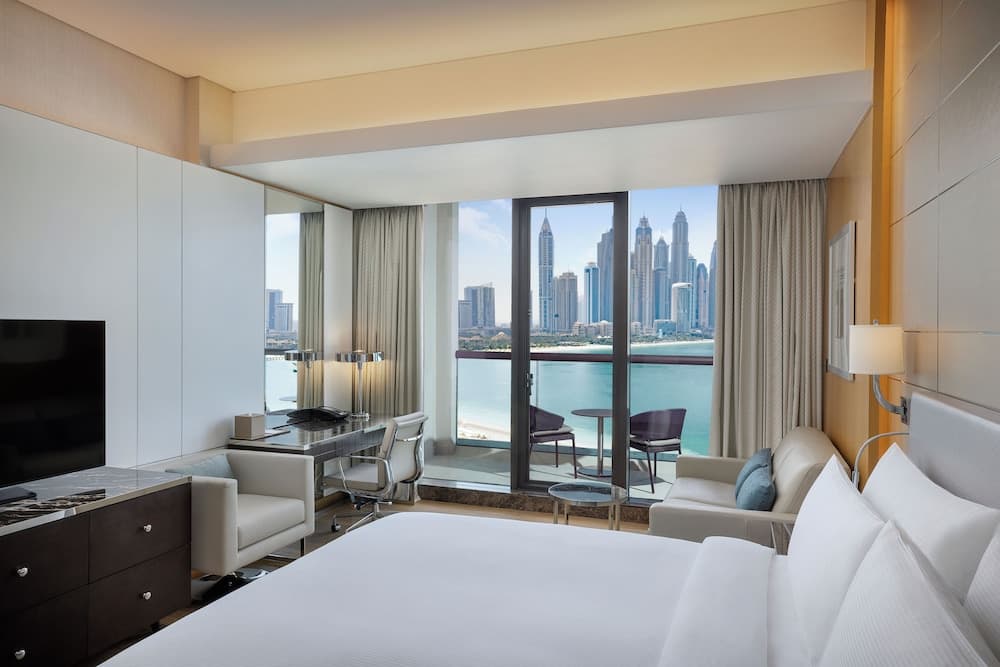 Guest room with a balcony view at Hilton Dubai Palm Jumeirah