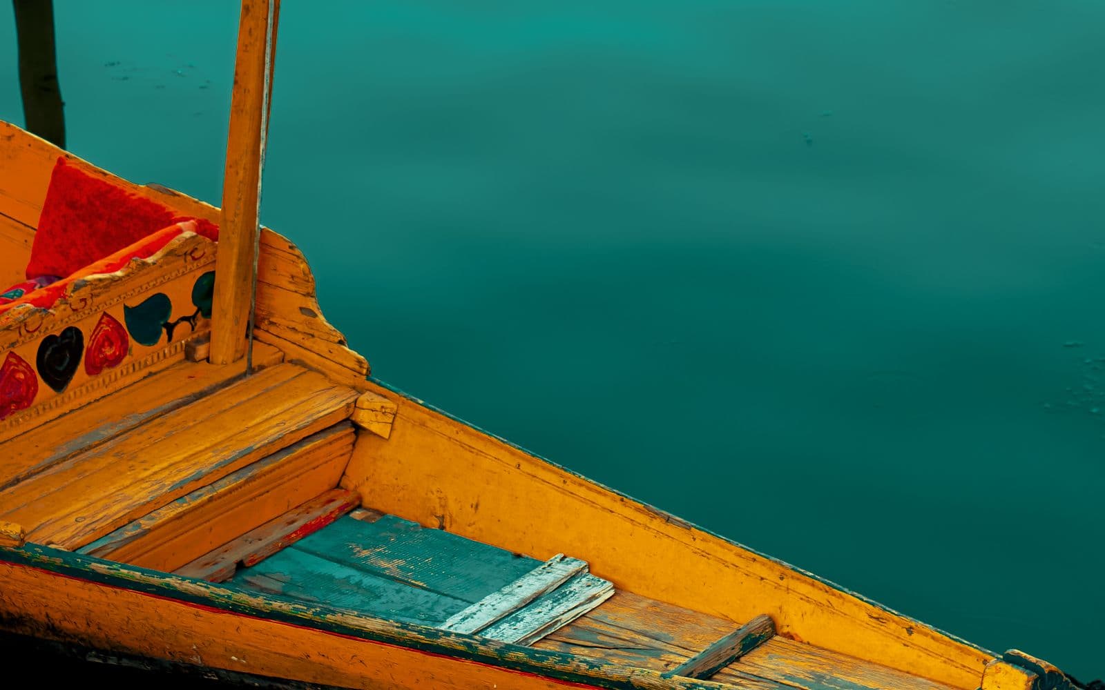 Yellow shikara boat on Dal Lake, Srinagar, Kashmir