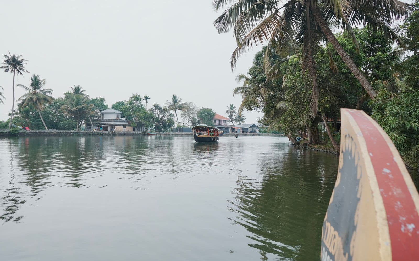 Traditional houseboat on the palm-lined Kerala backwaters