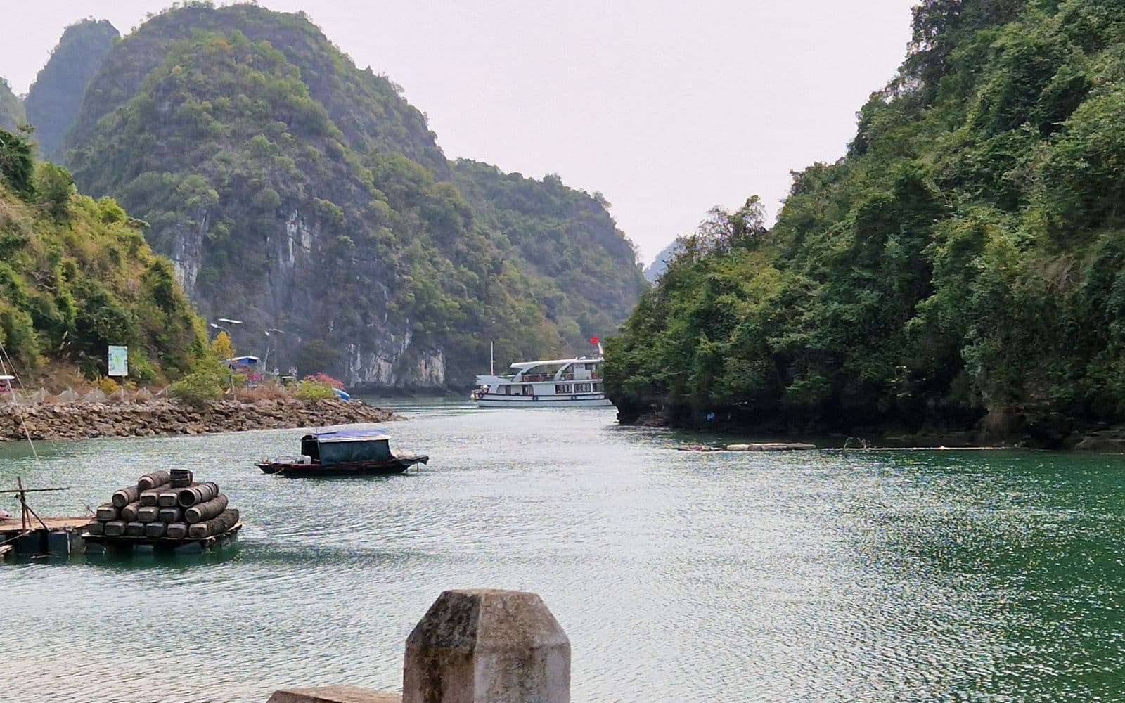 Boat cruising among the limestone karsts of Ha Long Bay, Vietnam