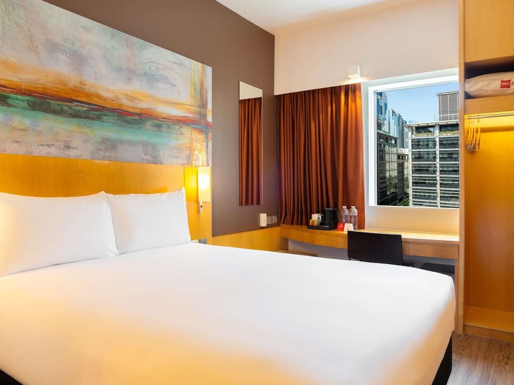 Guest room at ibis One Central, Dubai, with a double bed and city view
