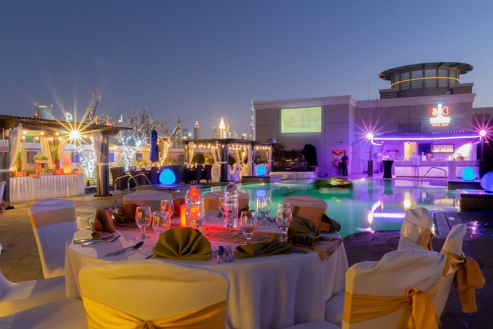 Rooftop pool deck at Crowne Plaza Dubai Jumeirah in the evening