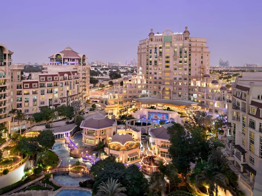 Swissotel Al Murooj Dubai and its gardens lit up in the evening, Downtown Dubai