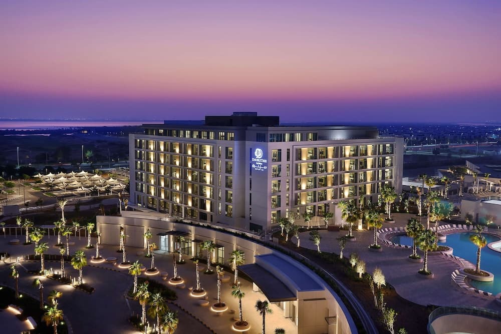 DoubleTree by Hilton Abu Dhabi Yas Island Residences lit up at night
