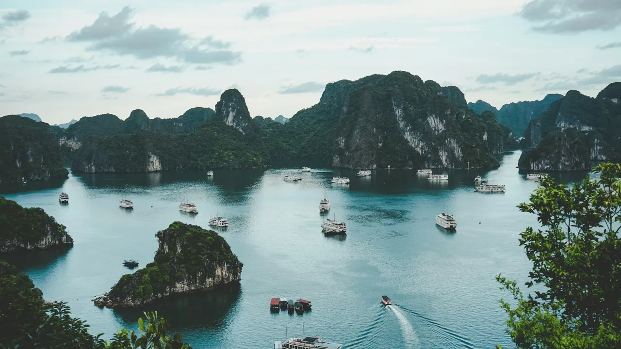 Boats among limestone karsts in Ha Long Bay, Vietnam